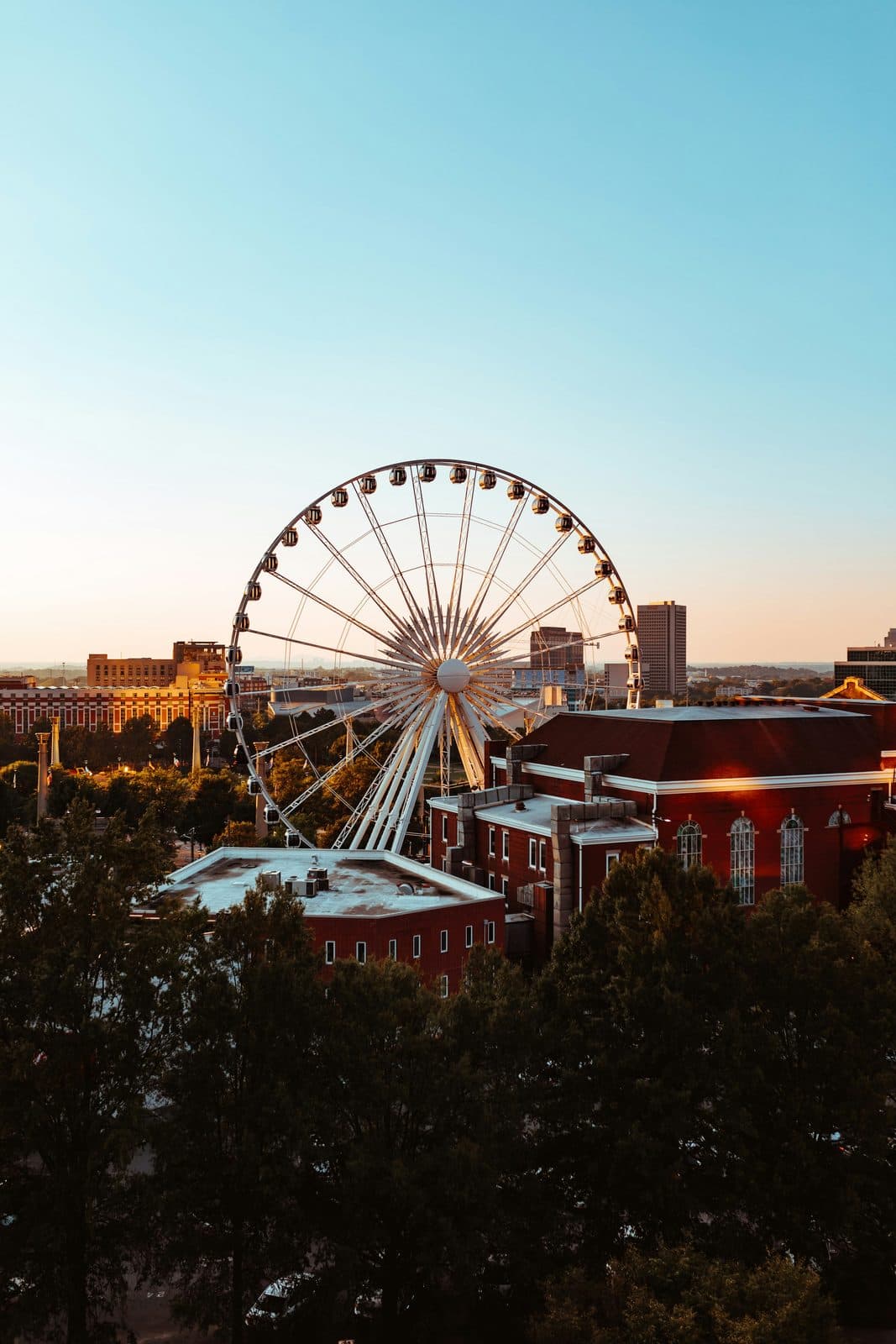 The SkyView Atlanta ferris wheel over the downtown Atlanta skyline at golden hour